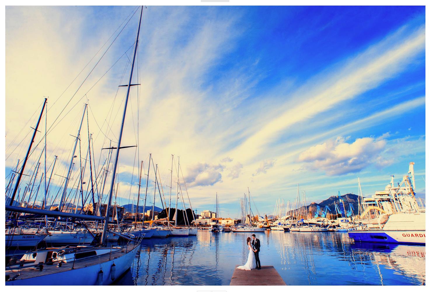 a couple amongst boats in Palermo port